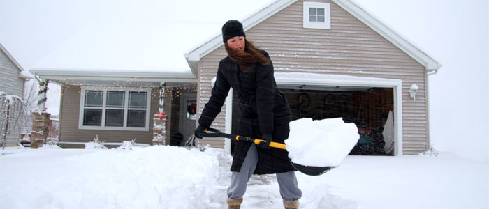 woman shoveling snow